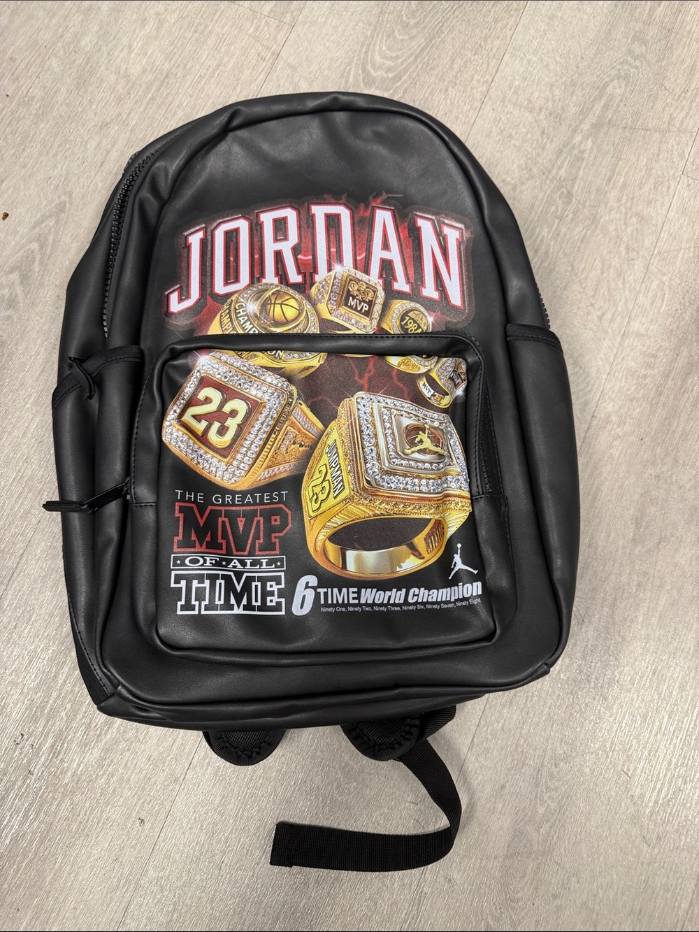 Jordan Black Backpack with Gold Ring Graphic